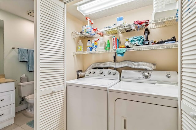 laundry room with laundry area and washer and clothes dryer