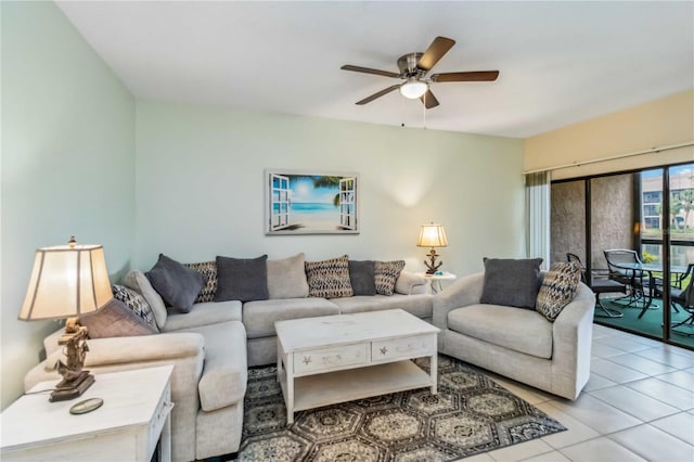 living room featuring a ceiling fan and light tile patterned floors