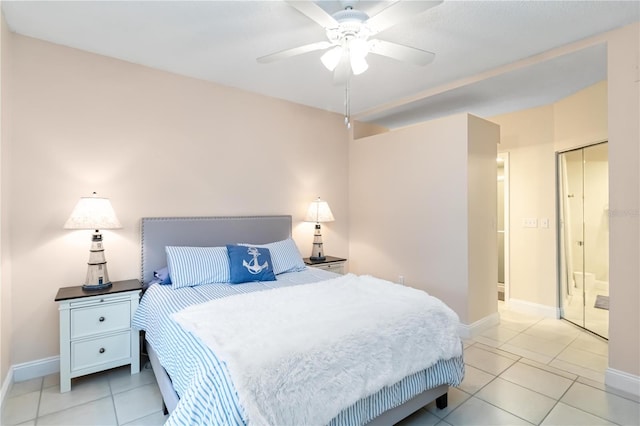 bedroom featuring light tile patterned floors, ceiling fan, and baseboards