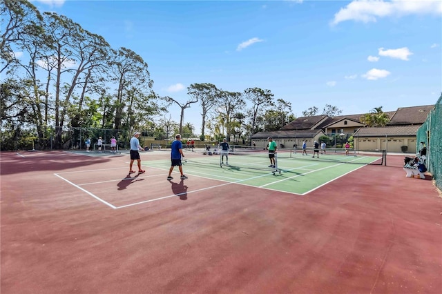 view of sport court featuring community basketball court and fence