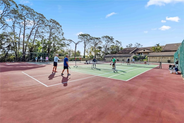 view of tennis court with fence