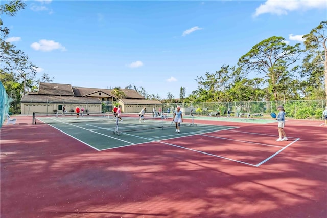 view of sport court with fence