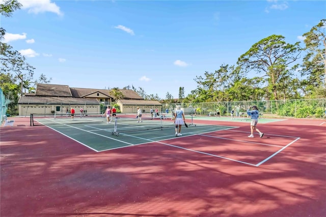 view of sport court with fence