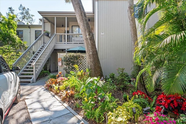 view of property featuring stairway