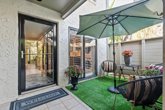 exterior space featuring a lawn and stucco siding