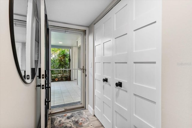 doorway to outside featuring light wood-style floors