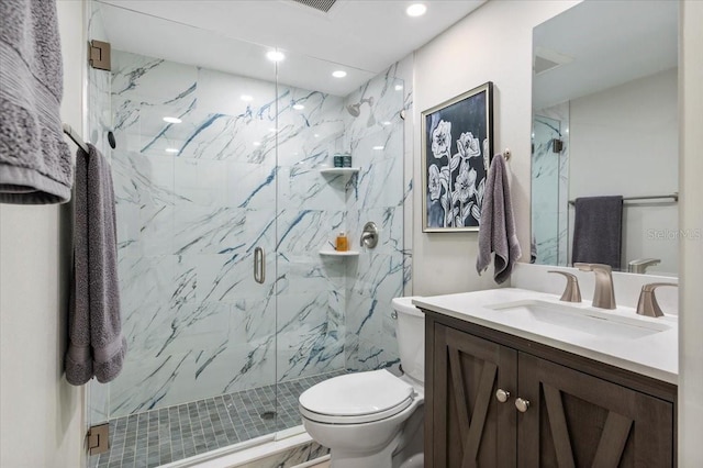 full bathroom featuring toilet, recessed lighting, a marble finish shower, and vanity