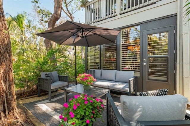 view of patio / terrace with an outdoor living space and a balcony