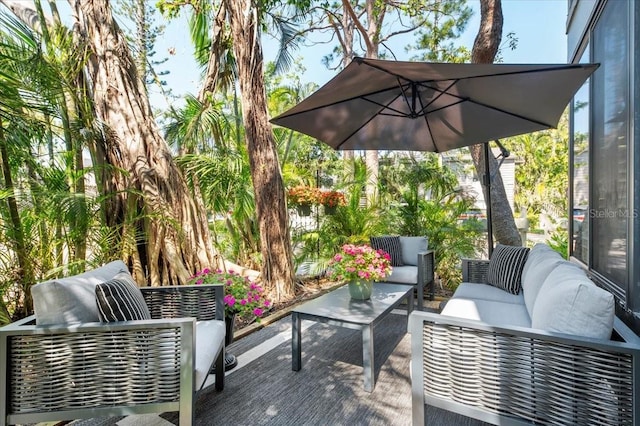 wooden terrace with outdoor lounge area