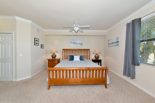 carpeted bedroom featuring ornamental molding, visible vents, baseboards, and a ceiling fan