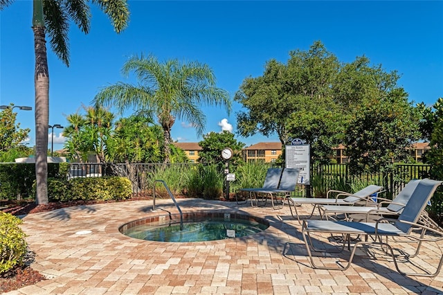 view of pool featuring a patio area and fence