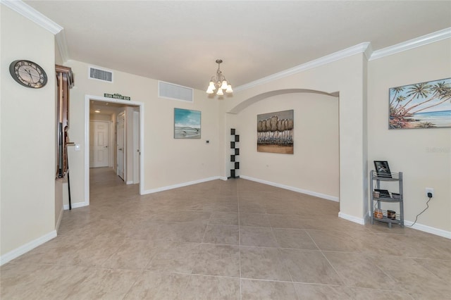 unfurnished room with crown molding, baseboards, visible vents, and a notable chandelier