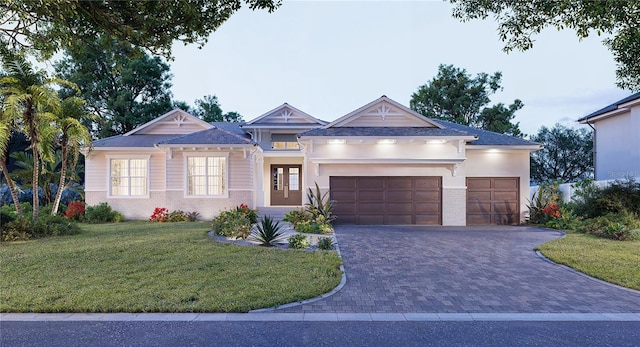 5103 Windward Ave, Sarasota, FL 34242 - view of front of property featuring a garage, a front yard, decorative driveway, and brick siding