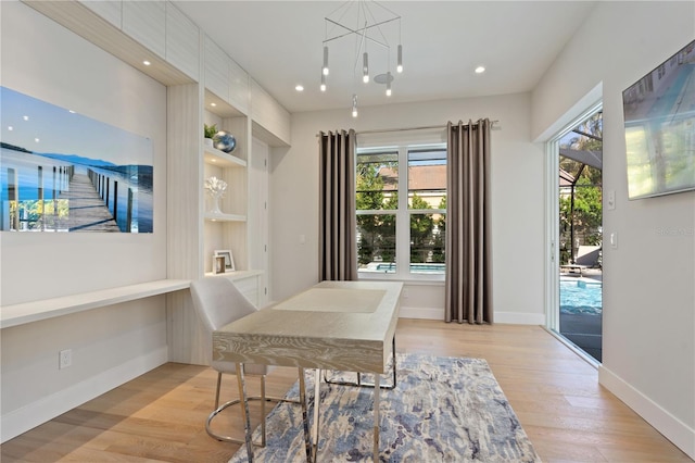 5103 Windward Ave, Sarasota, FL 34242 - dining area featuring healthy amount of natural light, light wood-style floors, a chandelier, and recessed lighting