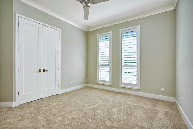 5103 Windward Ave, Sarasota, FL 34242 - unfurnished bedroom with carpet flooring, crown molding, a closet, and a ceiling fan