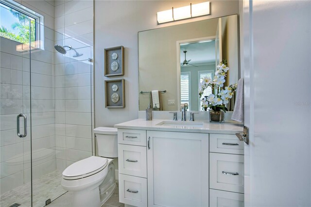 5103 Windward Ave, Sarasota, FL 34242 - full bath with a stall shower, vanity, and ceiling fan