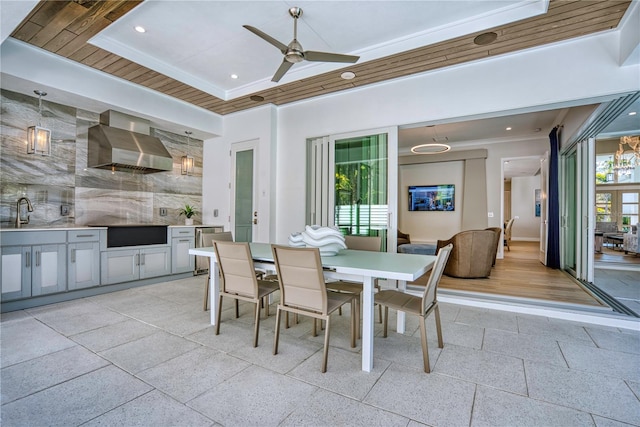 5103 Windward Ave, Sarasota, FL 34242 - dining area with a ceiling fan, dark speckled floor, crown molding, and recessed lighting