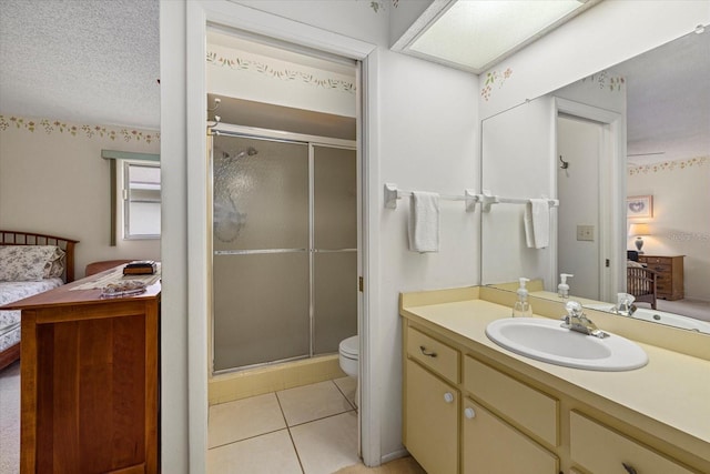 bathroom featuring toilet, a stall shower, connected bathroom, and tile patterned floors