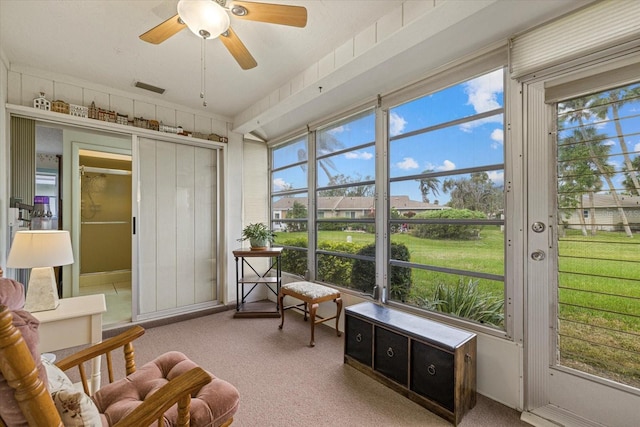 sunroom featuring ceiling fan and visible vents