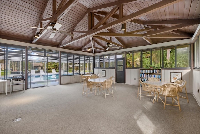 unfurnished sunroom with lofted ceiling with beams and a ceiling fan