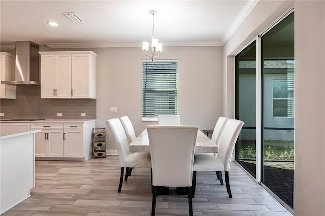 dining room featuring visible vents, ornamental molding, wood tiled floor, a notable chandelier, and recessed lighting