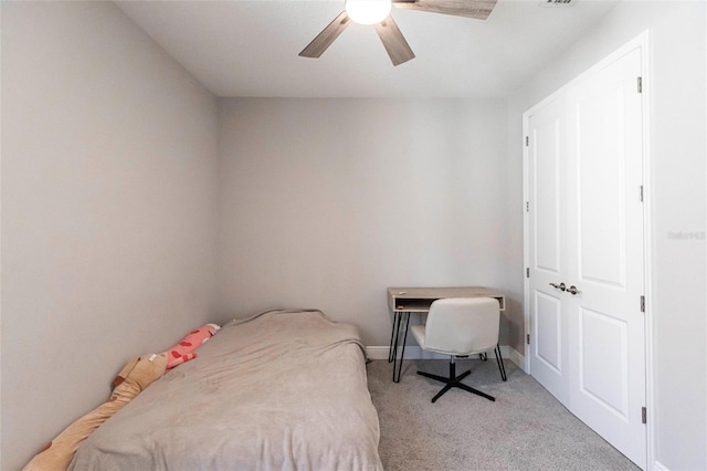 bedroom featuring carpet floors, baseboards, and a ceiling fan