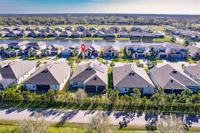 aerial view featuring a water view and a residential view