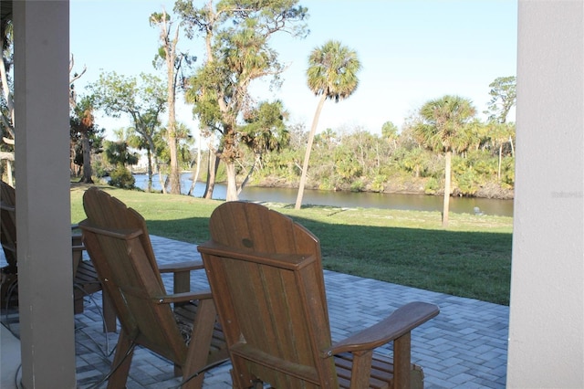 view of patio with a water view