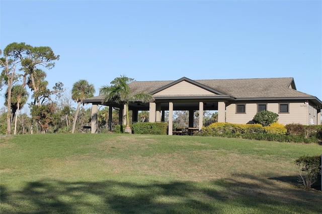 view of front of property featuring a front yard and a gazebo