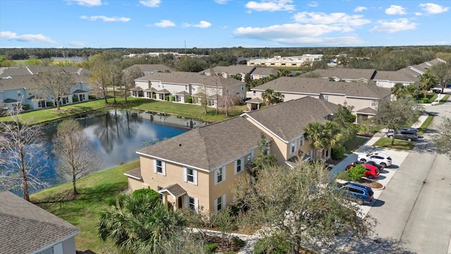 bird's eye view featuring a water view and a residential view