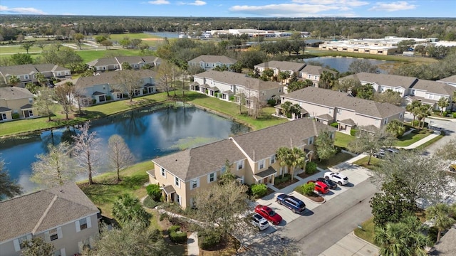 bird's eye view with a water view and a residential view