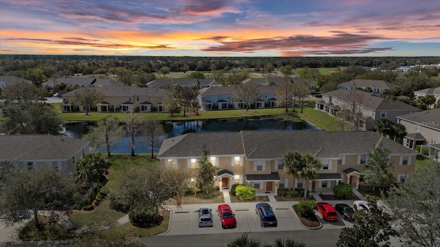 bird's eye view featuring a residential view and a water view