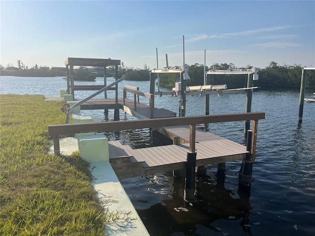 dock area featuring a water view and boat lift