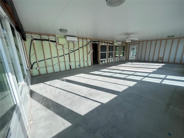 sunroom featuring a wall mounted air conditioner