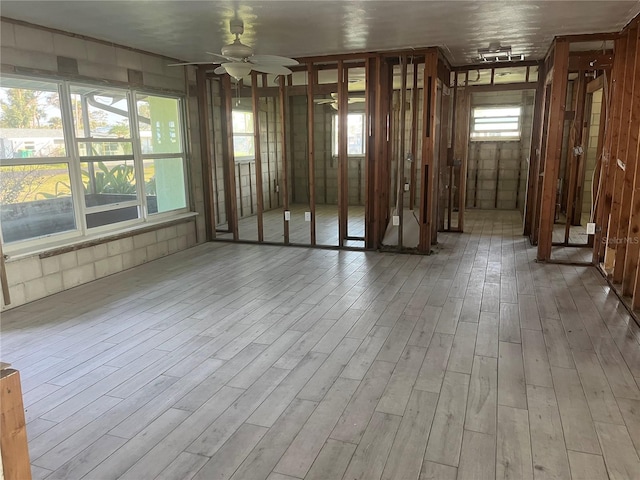 interior space featuring ceiling fan and wood finished floors