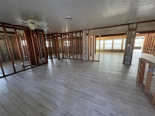 miscellaneous room featuring wood finished floors, visible vents, and a ceiling fan