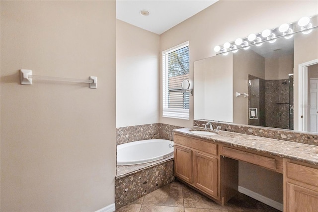 bathroom featuring tile patterned floors, a shower stall, a bath, and vanity