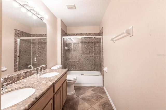 bathroom featuring baseboards, visible vents, a sink, and toilet