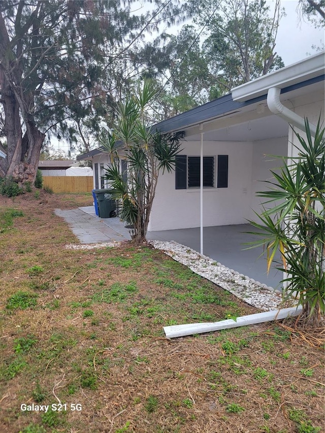 view of yard featuring a patio and fence