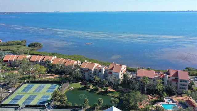 birds eye view of property with a residential view and a water view