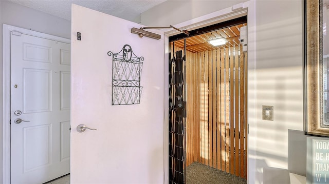 interior space featuring a textured ceiling