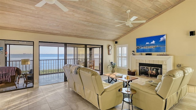 living area with a tiled fireplace, ceiling fan, wooden ceiling, and lofted ceiling