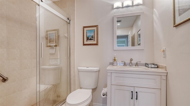 bathroom featuring visible vents, a stall shower, vanity, and toilet