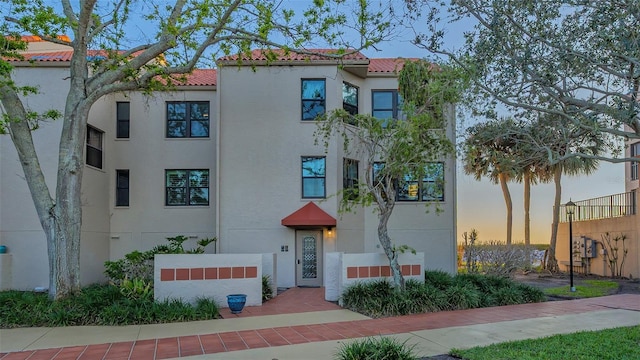 view of property at dusk