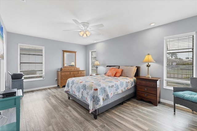 bedroom featuring light wood-style floors, recessed lighting, ceiling fan, and baseboards