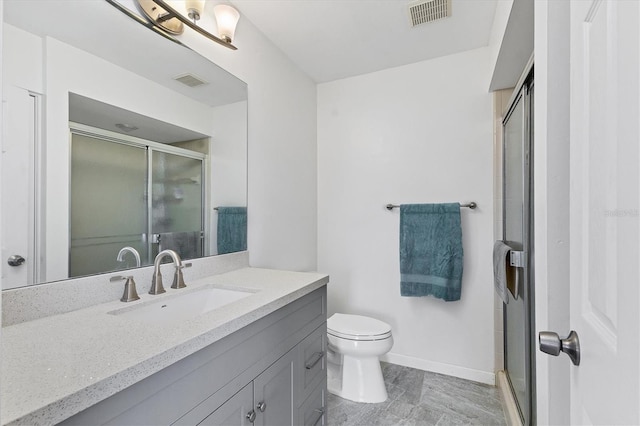 bathroom featuring a stall shower, visible vents, and vanity