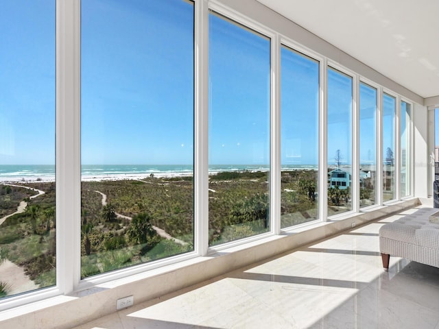 534 Beach Rd, Sarasota, FL 34242 - sunroom featuring a view of the beach, a water view, and a wealth of natural light