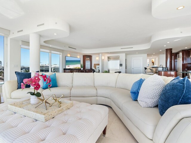 534 Beach Rd, Sarasota, FL 34242 - living room with recessed lighting and a tray ceiling