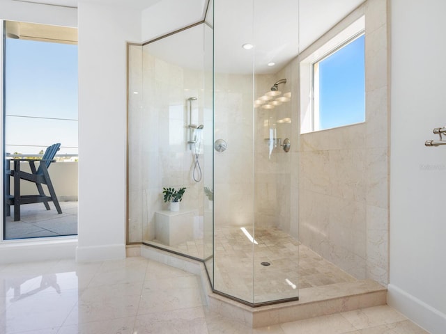 534 Beach Rd, Sarasota, FL 34242 - full bathroom featuring baseboards and tiled shower