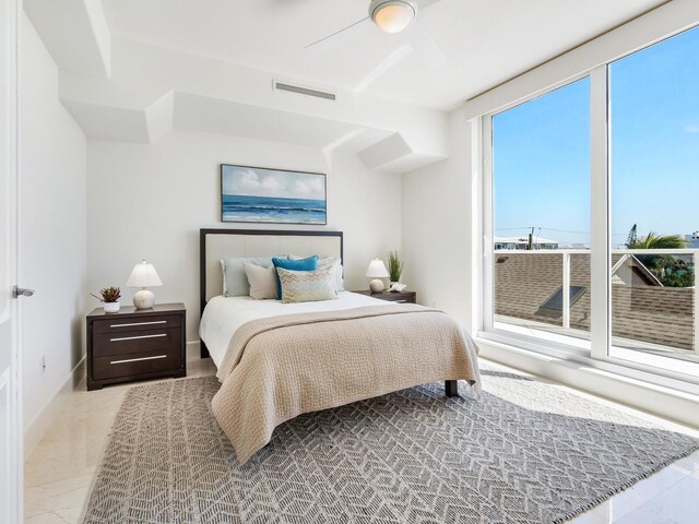 534 Beach Rd, Sarasota, FL 34242 - bedroom featuring visible vents, marble finish floor, and a ceiling fan